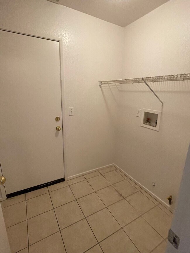 Building Photo - Adelanto Home-3 Bedrooms,2 Bathrooms, Laminate Floors, Indoor Laundry Room, Large Back Yard