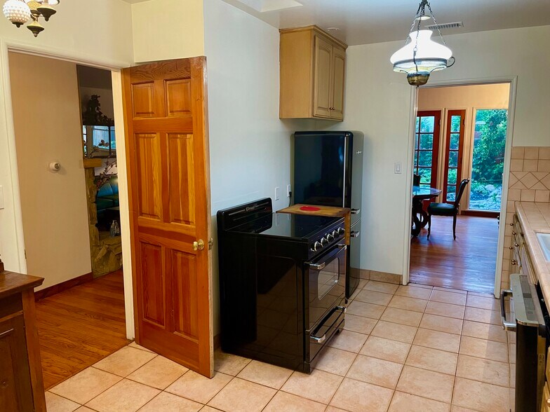 The kitchen has vintage style but modern appliances - 11449 Woodbine St