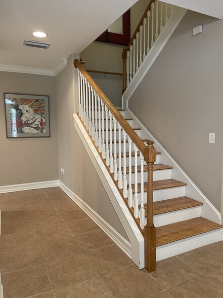 Stairway w large storage area underneath stairs - 365 Royal Caribbean Ct