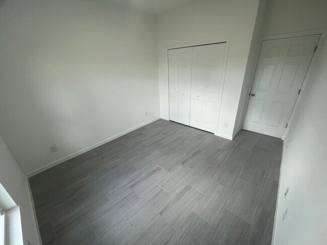 Building Photo - Brand-New 4BR/2BA Luxury Home with 2-Car Garage – Desirable 33971 Location