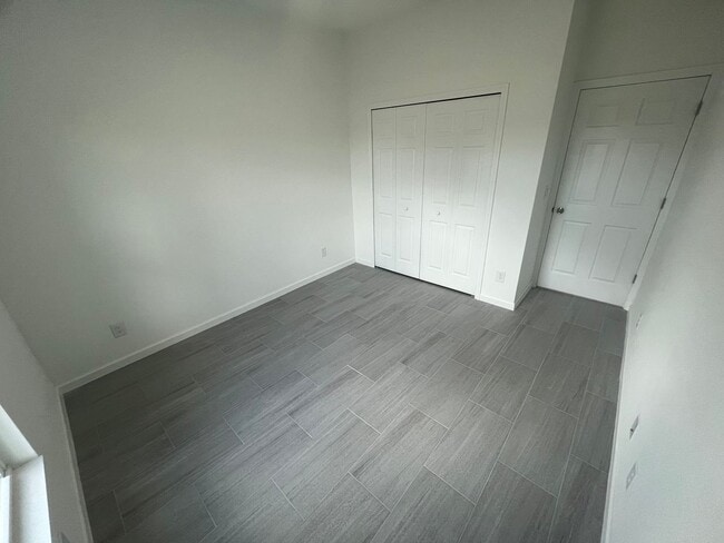 Building Photo - New 4 Bed / 2 Bath / 2 Car Garage Family Retreat in Desirable Lehigh Acres!