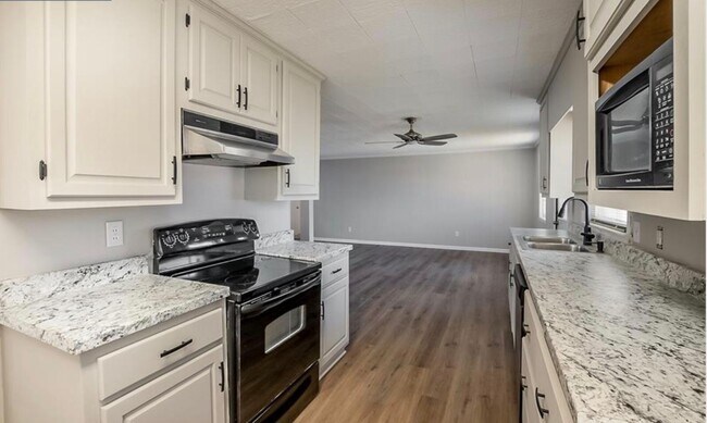 Building Photo - 3 bedroom, 2 bath - with a huge backyard and a walk in basement