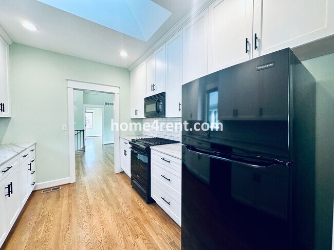 Building Photo - Charming Home Near Country Club Plaza w/ Gorgeous Updates, Wood Floors and a Two Car Garage!