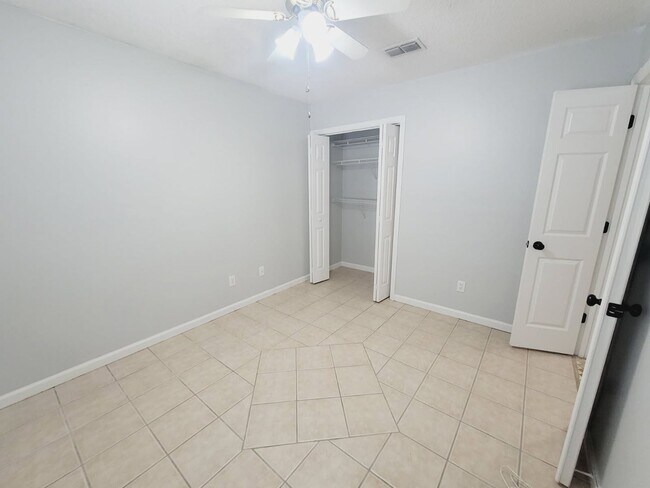 Building Photo - LOVELY 3/2 w/ Screened Porch, New Carpet in Bedrooms, Washer/Dryer, & Privacy Fenced Yard! Includ...