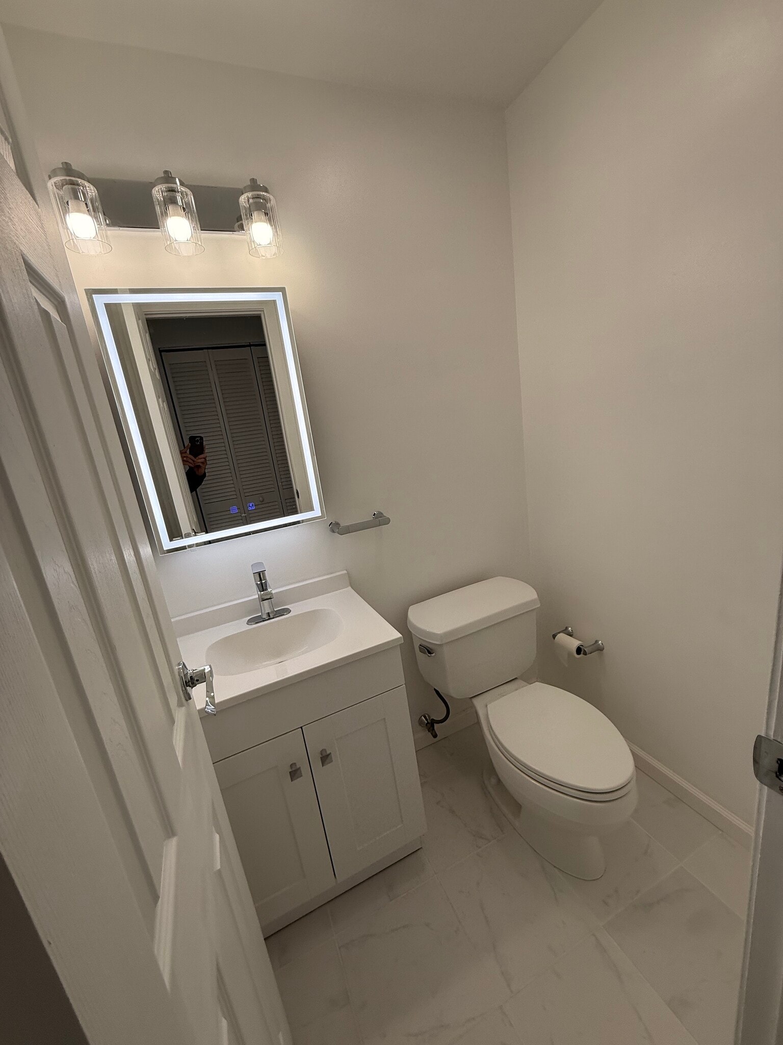 Half bath includes new vanity, sink, and medicine cabinet - 500 Chestnut St