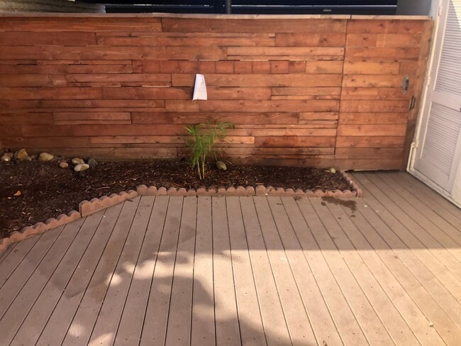 Building Photo - Beautiful Townhome with large fenced back patio, second story balcony, and two covered parking spots