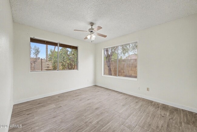 Building Photo - 6616 W Aire Libre Ave