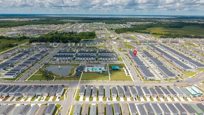 Building Photo - 3BR Center Lake Townhome | 2-Car Garage, Loft & Resort-Style Amenities