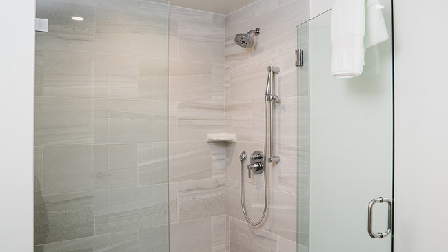 Oversized showers with floor to ceiling tile - Modera Edgewater