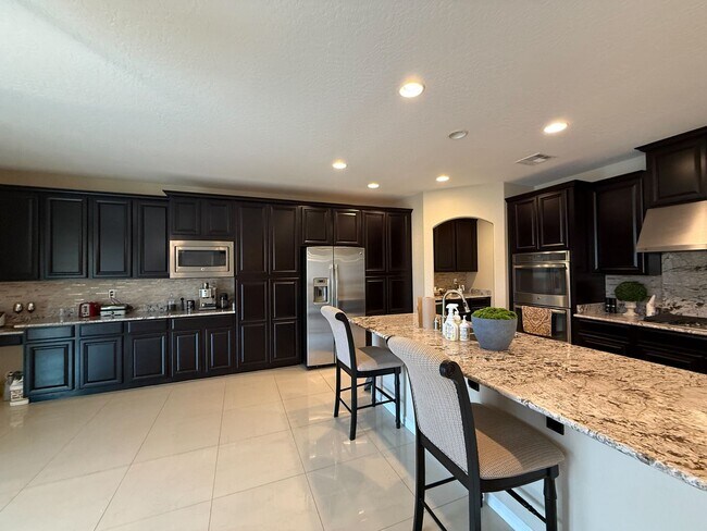 Building Photo - Luxury 6/BD 4.5/BA Large Furnished Home with Dual Primary Suites in Gated Community