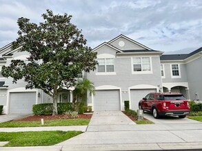 Building Photo - MOVE IN AUGUST! Beautiful 3 bed 2.5 bath townhome with large screened in back porch & 1 car attac...