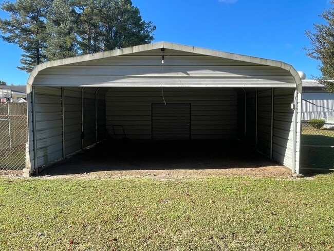 Building Photo - Quiet setting between Angier and Fuquay Va...