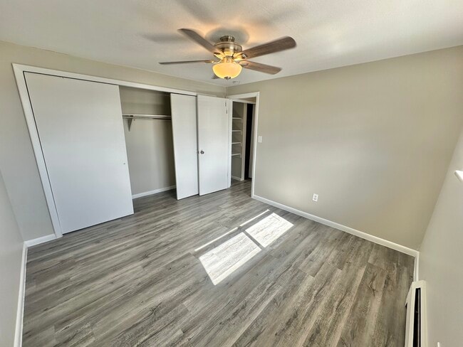 Experience comfort in this chic bedroom featuring modern amenities and ample storage. - Allison West Apartments
