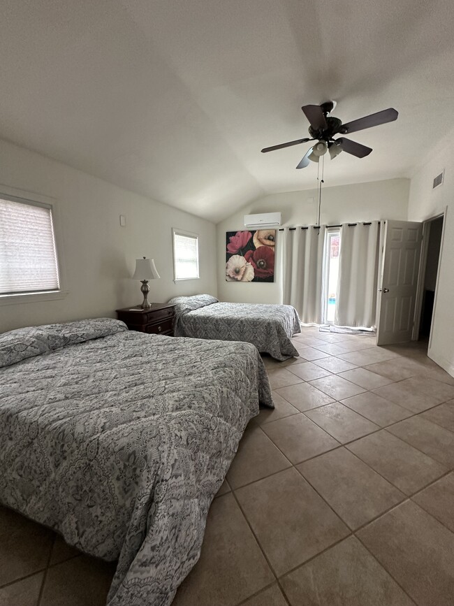 Double queen beds with pool view. - 7403 Vanalden Ave