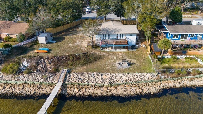 Building Photo - Stunning 4-Bedroom, 3-Bath Waterfront Home in Choctaw Beach – 140ft of Bayfront Bliss!