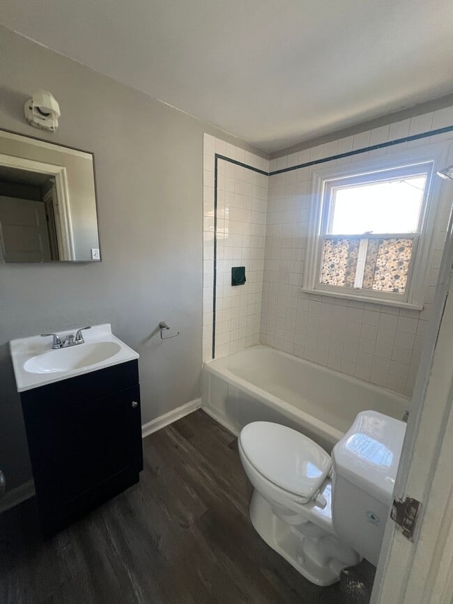 Building Photo - Spacious-Charming-Two Plus Bedrooms-Sunny Windows-Fenced Yard-Pet Family Members Welcome!