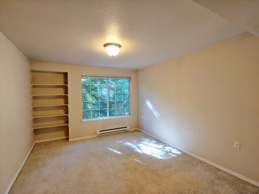 Building Photo - Lovely Condo in the Woods - Deck - Carport - FP - Closets - WD/DW - Fitness Center - Pools