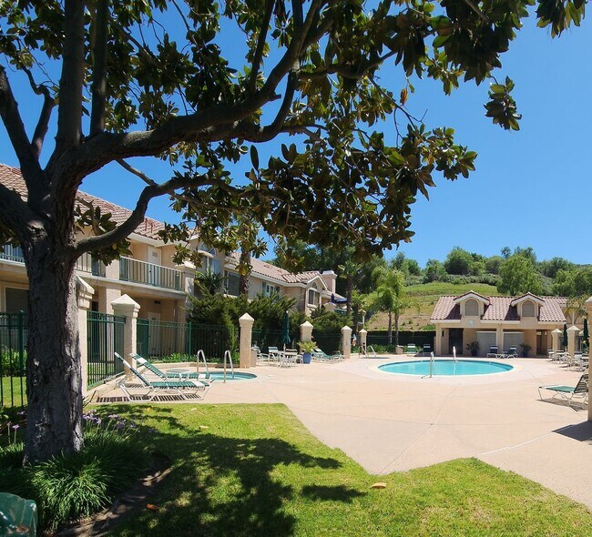 Building Photo - Gorgeous 2 bedroom newly renovated upstairs corner condo in gated community with pool & hill side...