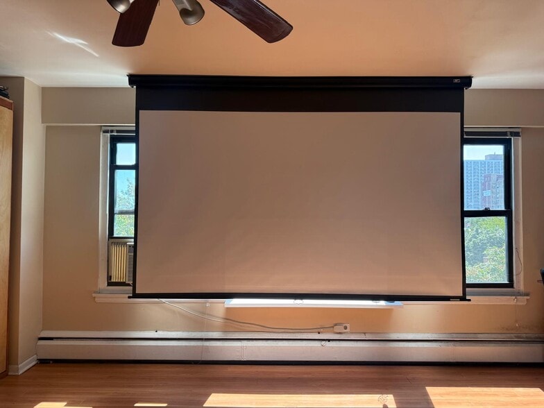Projector screen (opposite couch) - 4880 N Marine Dr