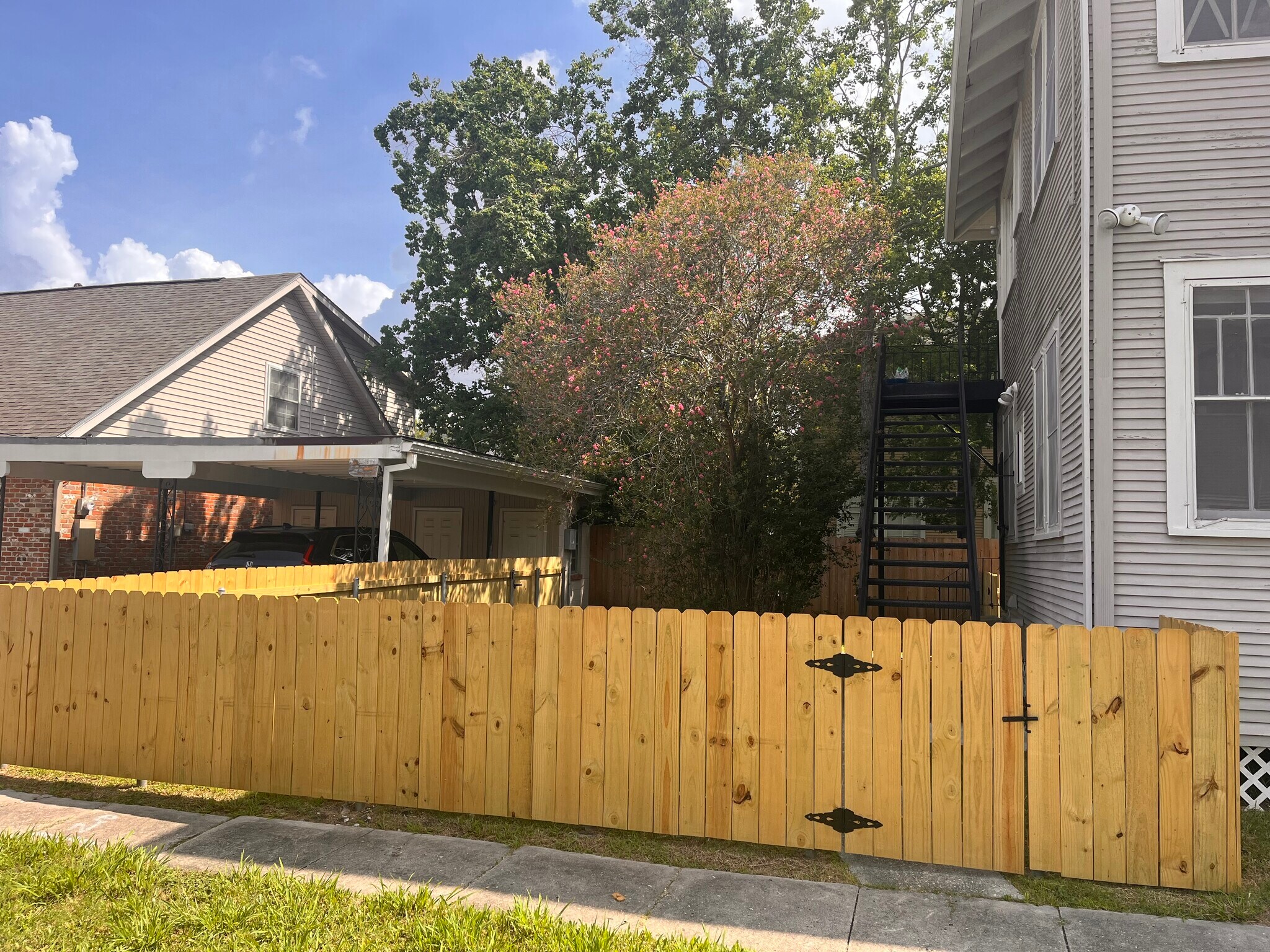 Back yard with covered parking and storage - 2900 Palmer Ave
