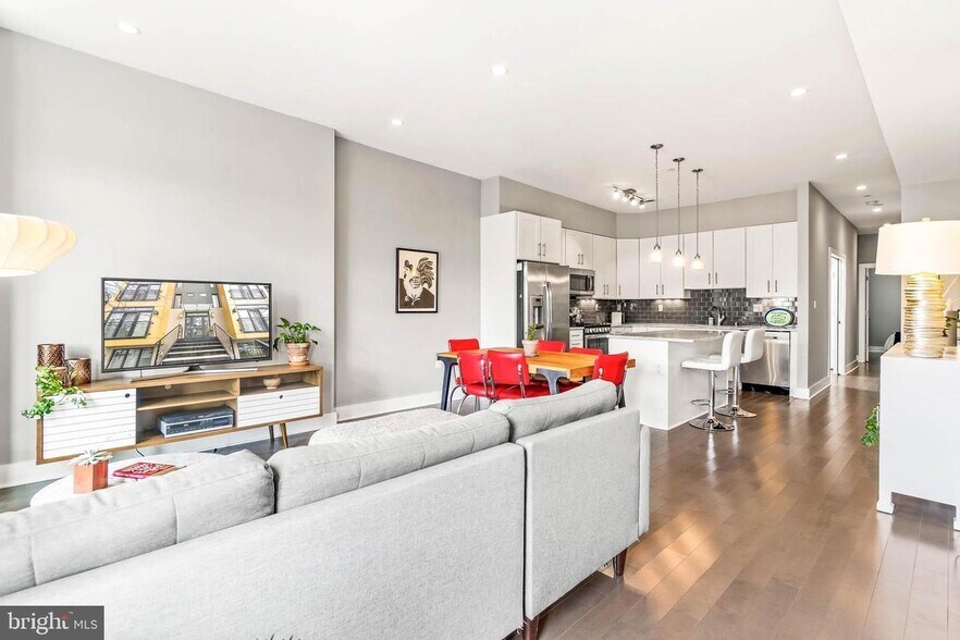 Open floor plan, showing views from the windows of the living room, facing the kitchen. - 3821 14th St NW
