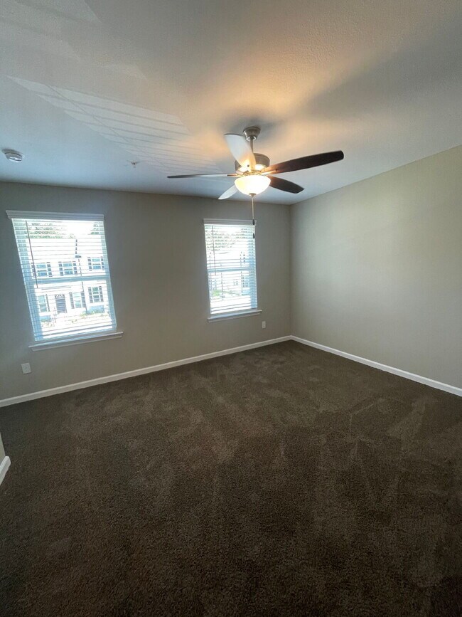Building Photo - Spacious New 3BR/3BA Condos – Pool & Gym Amenities