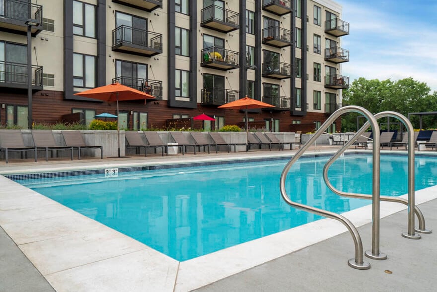 Our resort-style pool offers the perfect spot to unwind, soak up the sun, and enjoy a refreshing swim on warm days. - The Preserve at Normandale Lake