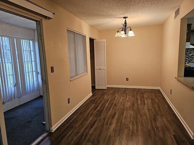 Dinning room with open window to kitchen - 589 Fairways Cir