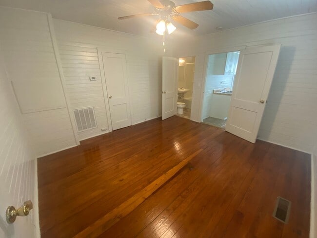 Building Photo - Walltown duplex with gleaming floors, a front porch, and a large pantry — all under $1,300.