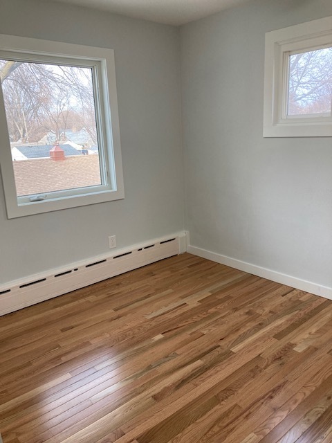 Smaller bedroom, again with windows on two walls. - 1430 4th St N