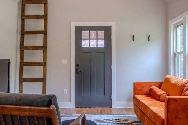 Building Photo - Completely remodeled like new Gingerbread midtown cottage with gleaming hardwoods, converted from...