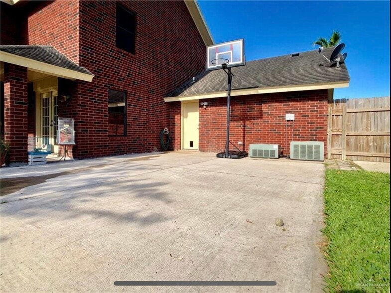 Behind the garage. Basketball? - 1305 Ambrosia Dr