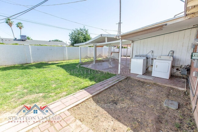 Building Photo - 8119 E Amelia Ave