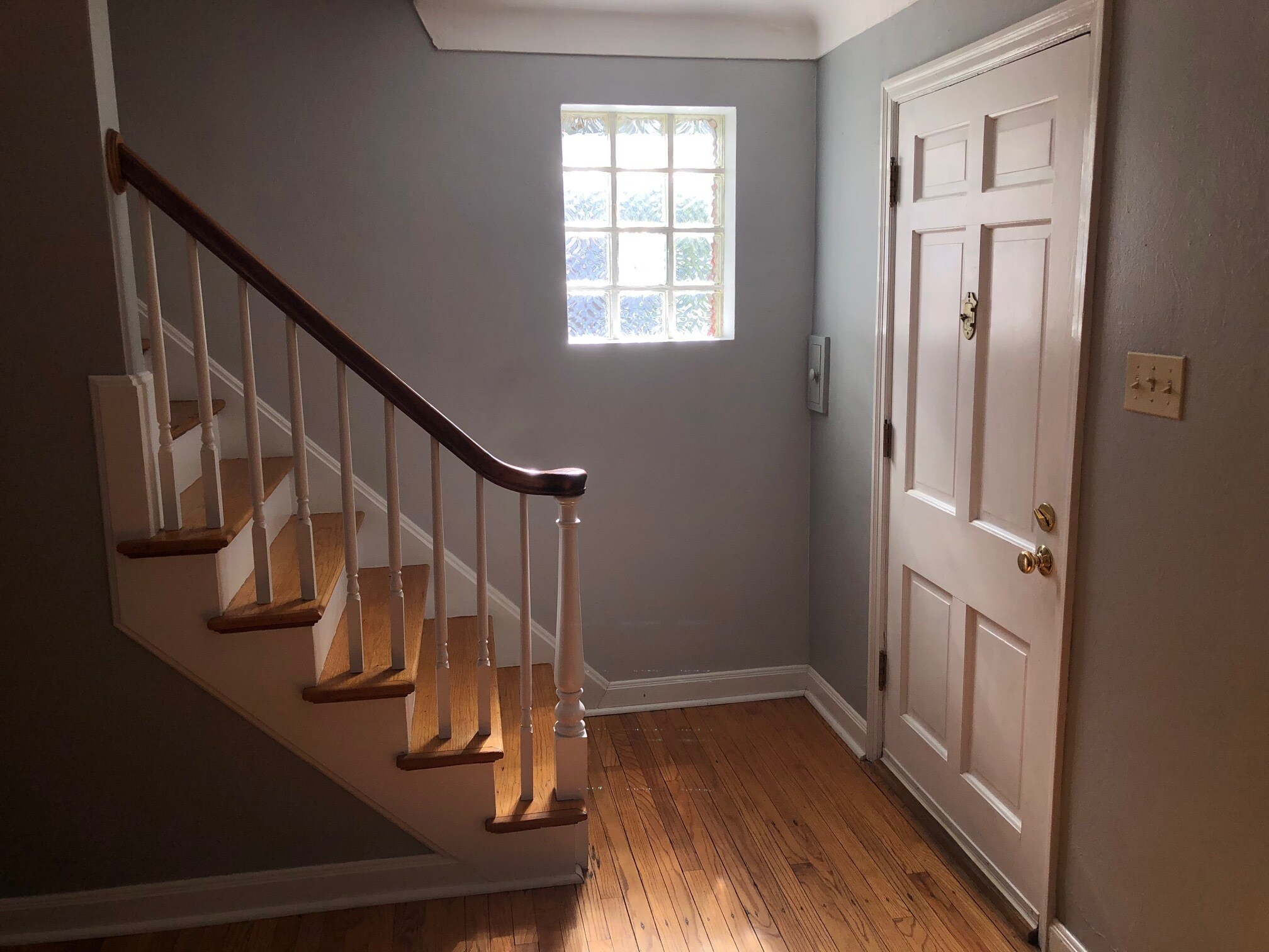 Front door and stairs to second floor - 6959 Pernod Ave