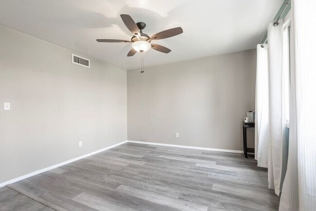 Building Photo - Discover this charming two-story townhome