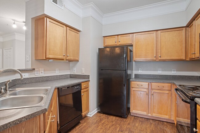 Kitchen with Black Appliances - Carrington Park at Huffmeister Apartments