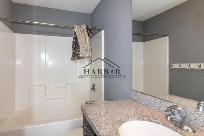 Building Photo - Updated 4 Bedroom Home with Remodeled Kitchen & Tiered Deck