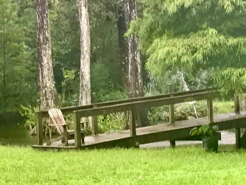 Wood bridge over pond - 17587 Old Covington Hwy