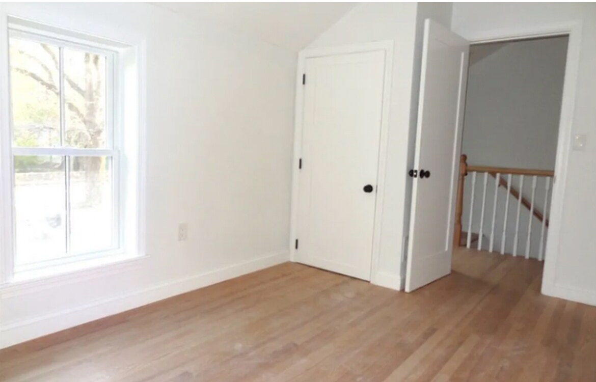 Bedroom 1 has high ceilings up to attic height. - 81 Pleasant St