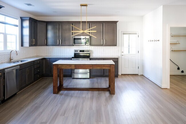 Building Photo - Like-new 3 bedroom, 2.5 bath house with an organic pond!