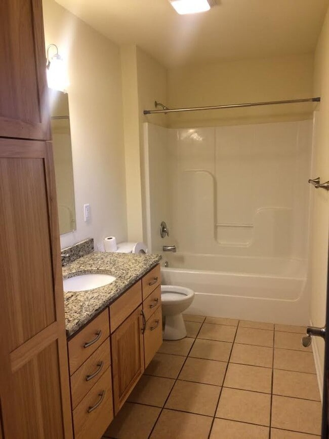 Building Photo - Live Large in This Spacious 2BR Townhome –...