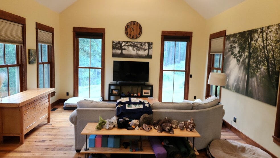 Vaulted ceilings and floor to ceiling windows in the living room - 6710 Farm To Market Rd
