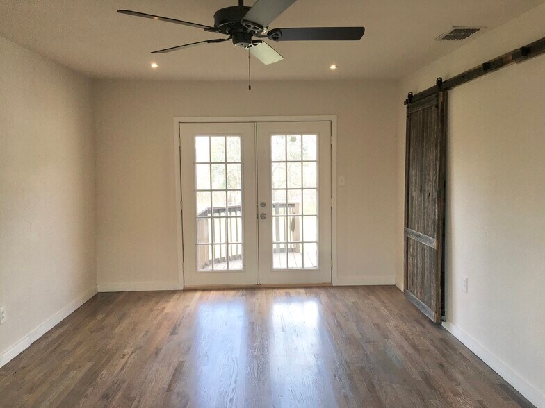 Master bedroom with French doors to deck - 5131 Wildflower Dr
