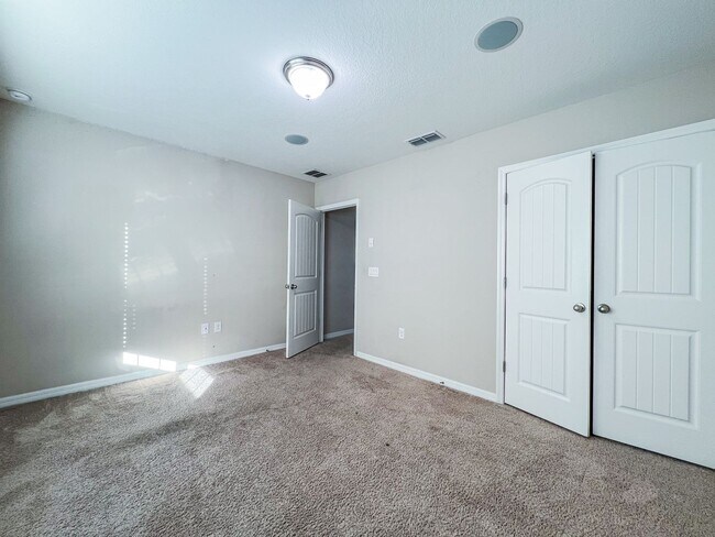 Building Photo - Spacious 4-Bedroom Townhome in Harmony – A Perfect Blend of Nature & Comfort!