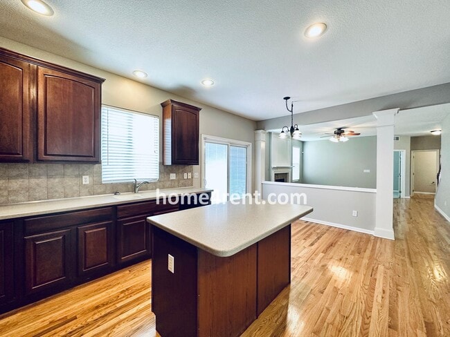 Building Photo - Wood Floors, Open Layout, Plenty of Natura...