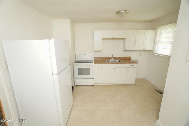 Building Photo - Lawn Care Included in Jville City Limits!