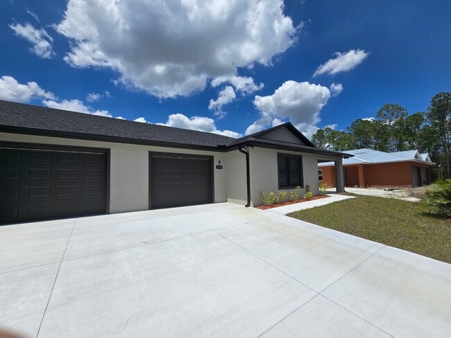 Building Photo - Brand-New 4-Bed Beauty with Attached Garage in Palm Bay – Modern Comfort, Prime Convenience!