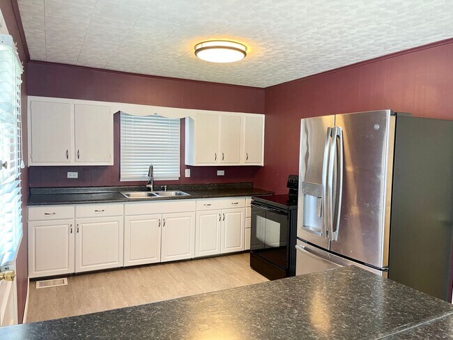 Building Photo - East Side Gem – Spacious 2BR Home with 2 C...