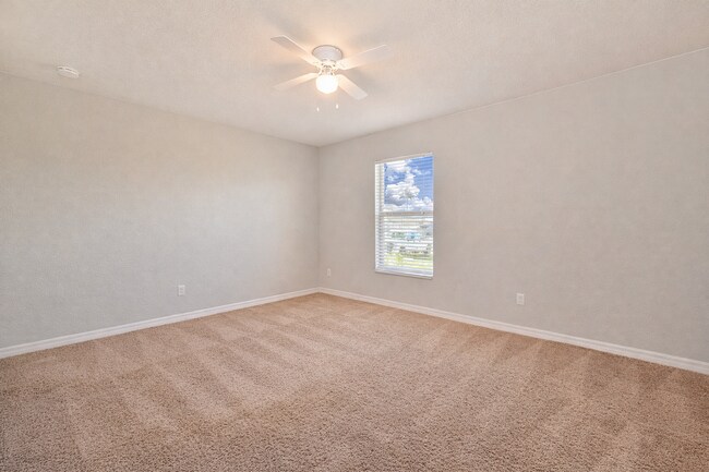 Building Photo - Spacious Three-Bedroom Home with Open Floor Plan, Large Yard & Screened Patio