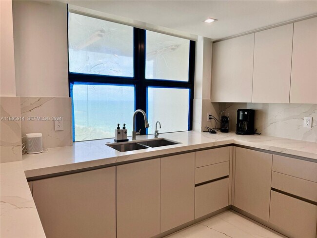 Building Photo - 9801 Collins Ave